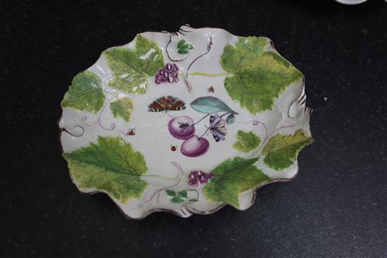 A pair of Chelsea botanical vine leaf dishes, c.1755 and a a pair of similar Bow dishes, c.1758, W. 21.5cm and 26cm, one Bow dish repai
